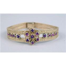 A 14K YELLOW GOLD MESH AND RUBY BRACELET