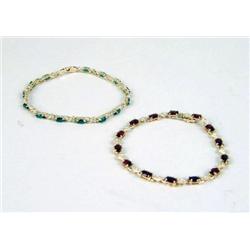 A 14K YELLOW GOLD, GARNET AND DIAMOND BRACELET