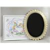 Image 1 : A PAINTED METAL SCALLOP-EDGED OVAL MIRROR