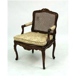A LOUIS XV-STYLE CARVED WALNUT SIDE CHAIR