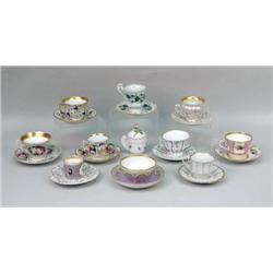 A GROUP OF ASSORTED TEA CUPS AND SAUCERS