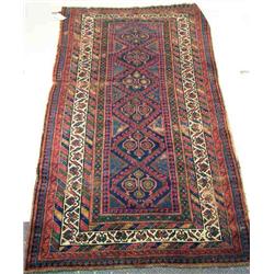 A LARGE ORIENTAL RUG