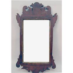 A CHIPPENDALE PARCEL-GILT MAHOGANY MIRROR