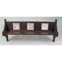AN AESTHETIC WALNUT SHELF WITH THREE MINTON TILES