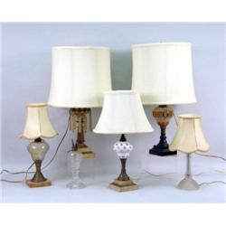 A GROUP OF FIVE OIL LAMPS