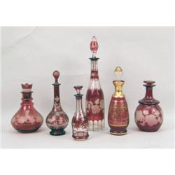 A GROUP OF SIX RUBY CUT-TO-CLEAR DECANTERS