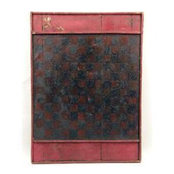 A LARGE BLACK-AND-RED-PAINTED CHECKERBOARD