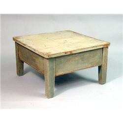 A PAINT-DISTRESSED COFFEE TABLE