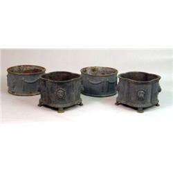 FOUR CAST-IRON OUTDOOR PLANTERS