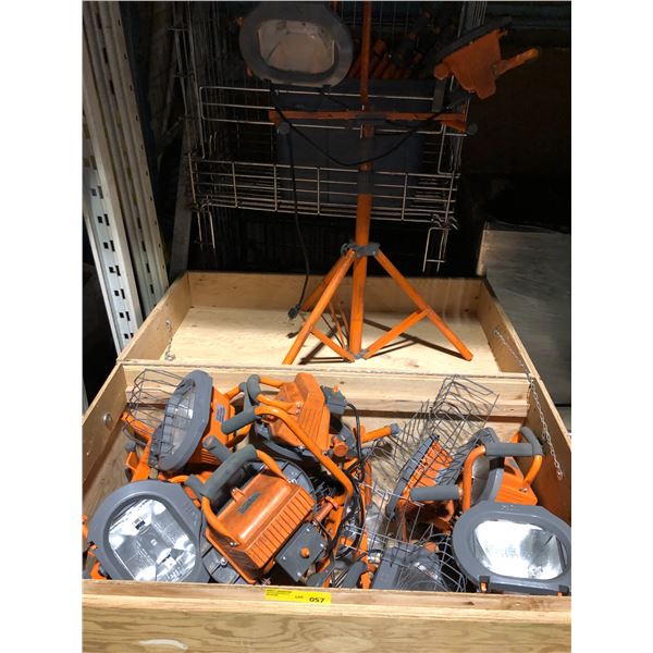 Bin of Dual HDX Orange Floodlights with tripods.  Approximately 7 lights with rolling wood bin (25in