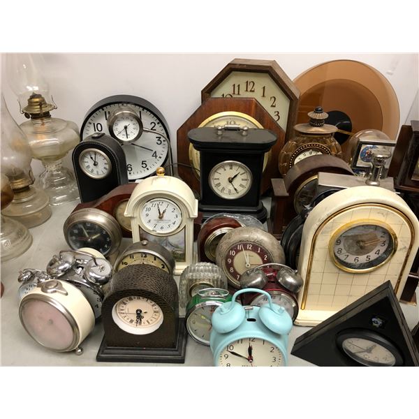 Large Grouping Of Clocks and Glass Lamps