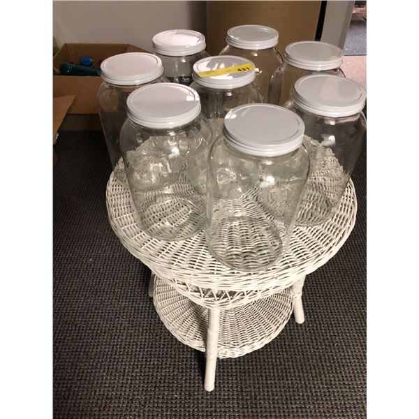 Group of 8 Large Glass Containers on Painted White Rattan Table