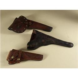 THREE LEATHER HOLSTERS
