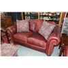 Image 1 : Ox-blood leather upholstered and nail head decorated La-Z-boy loveseat with three throw cushions fro