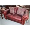 Image 1 : Ox-blood leather upholstered and nail head decorated La-Z-boy loveseat with three throw cushions fro