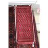 Image 2 : Two handmade Iranian wool scatter rugs, each with deep red backgrounds and geometric designs, 23" X 