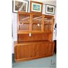 Image 1 : Danish made chest on chest teak cabinet with two large rolling doors exposing multiple drawers and s