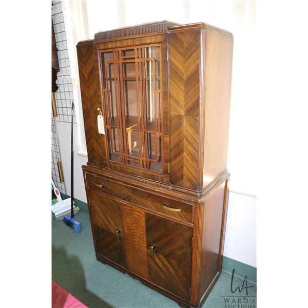 Art Deco matched grain walnut china cabinet with original pulls and finish, 68" in height and 38" wi