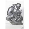 Image 2 : Inuit carving of a hunter holding a fish, 7" wide and 8 1/2" in height, unsigned, consignor purports
