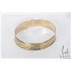 Image 1 : Ladies 18kt yellow gold 1/2" diameter bangle, 7 1/4"