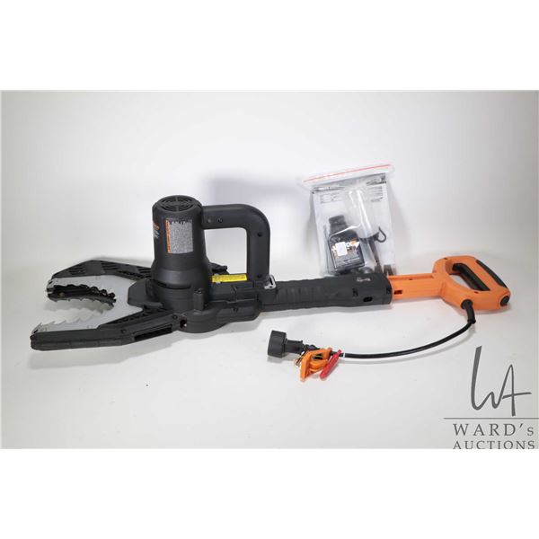 Worx brand electric jaw saw with accessories including oil, oil dispenser, wrench and manual, workin