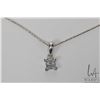 Image 1 : 18kt white gold 24" neck chain marked Italy 750 and an 18kt white gold four diamond pendant