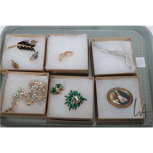 Selection of collectible costume jewellery including hand painted brooch with artist signature, sign