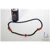 Image 1 : Black onyx beaded necklace with red jasper Koi, 32" in length