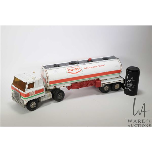 Two vintage Ertl pressed steel trucks including Co-Op tanker and a Link Hardware Stores truck and tr