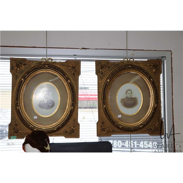 Pair of antique gilt frames with floral decoration, oval opening approximately 17" X 14" fitted with