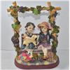 Image 1 : VINTAGE BOY AND GIRL ON SWING STATUE