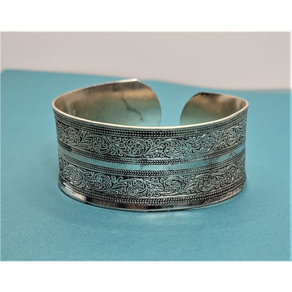 15)  TIBETAN SILVER HEAVILY CARVED CUFF STYLE