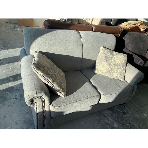 Light Grey Studded 2 Seat Loveseat with thrown cushions FLOOR DISPLAY MODEL- pick up Dec. 30 from 9-
