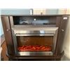 Image 1 : Electric Heating fireplace with cabinet includes remote stainless steel front and cabinet with side 