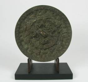 A SUPERB TANG DYNASTY BRONZE MIRROR, c.618-90