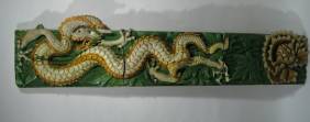 A LATE CHING DYNASTY SANCAI GLAZED PANEL, c.1