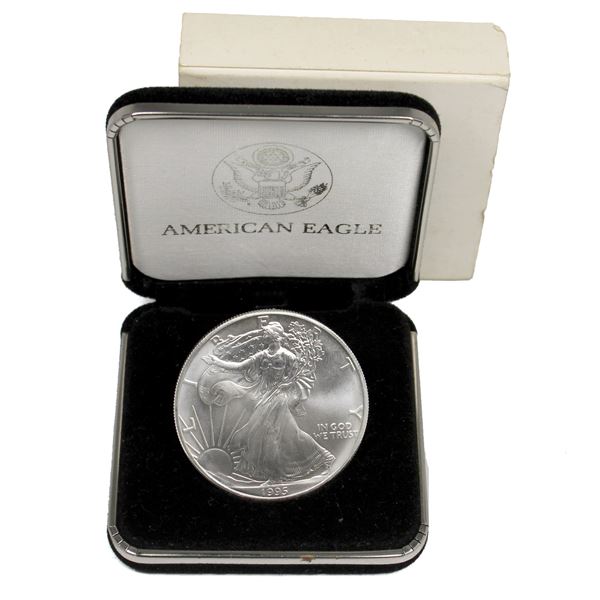 1995 USA $1 Silver Eagle 1oz .999 Fine Silver Coin (Tax Exempt). Lightly toned.  Comes with original