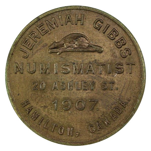 1907 Numismatist Card. Jeremiah Gibbs. Hamilton, ON. The Ambitious City Token 28mm diameter.