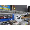 Image 1 : Shelf Lot of Canes, Die Cast Car, Charger Cords & Tripod Stabd