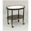 Image 1 : AN OVAL GILT-DECORATED BLACK LACQUER SERVING CART