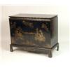 Image 1 : A CHINOISERIE GILT-DECORATED BLACK LACQUER CHEST ON STAND