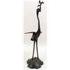 Image 2 : A PAIR OF BLACK-PAINTED METAL CRANE FIGURAL CANDLESTICKS
