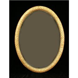 AN EARLY GILTWOOD OVAL FISH-SCALE MIRROR