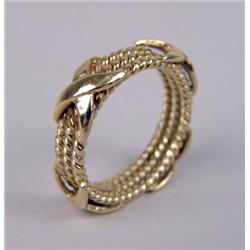A TRIO 18K YELLOW GOLD "X" DESIGN RING
