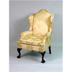 A GEORGE II-STYLE CARVED MAHOGANY WING CHAIR