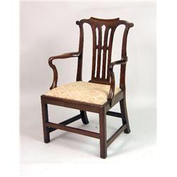 A GEORGE III CARVED MAHOGANY ARMCHAIR