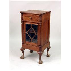 A GEORGIAN-STYLE CARVED MAHOGANY CABINET