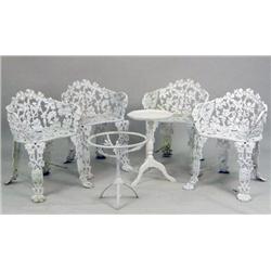 A SET OF WHITE-PAINTED CAST IRON GARDEN FURNITURE