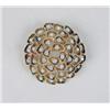 Image 1 : AN 18K YELLOW GOLD AND DIAMOND MODERN CIRCULAR BROOCH