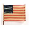 Image 1 : A 44-STAR AMERICAN FLAG ON CARVED WOODEN STANDARD